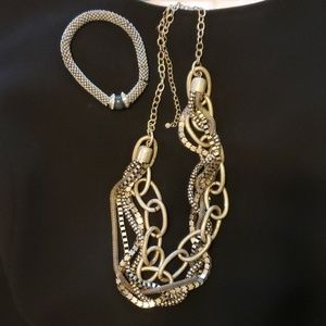 Silver Necklace and silver stretchy bracelet.